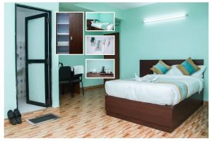 Postel nebo postele na pokoji v ubytování Yaksa Hotel Pvt. Ltd.