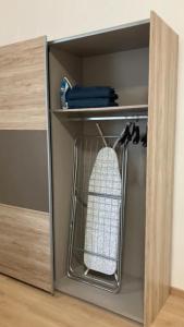 a cupboard with a shelf with a bag in it at Nick's place-brandnew, central and quiet apt by Margit bridge in Budapest