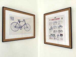 a framed picture of a bike on a wall at Villa K'nell - La Possession in La Possession