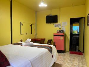 מיטה או מיטות בחדר ב-Khao Chang View Resort