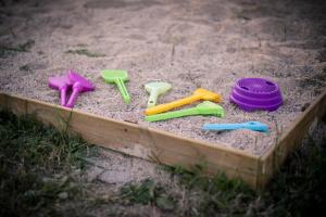 a group of plastic toys in a sandbox at VILLA CHETRUS Casa en plena naturaleza in Rubí +82 photos