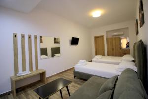 Postel nebo postele na pokoji v ubytování Ortus Rooms