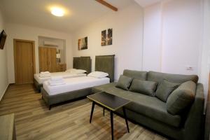 Postel nebo postele na pokoji v ubytování Ortus Rooms