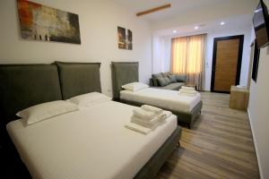 Postel nebo postele na pokoji v ubytování Ortus Rooms
