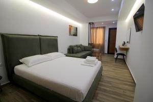 Postel nebo postele na pokoji v ubytování Ortus Rooms