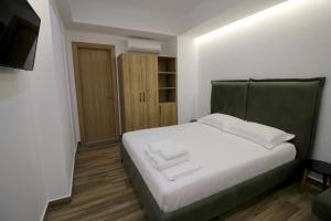 Postel nebo postele na pokoji v ubytování Ortus Rooms