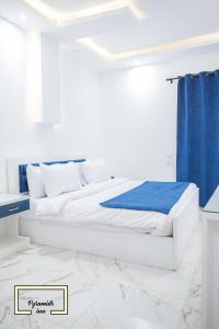 Letto o letti in una camera di Egyptus Pyramids Inn