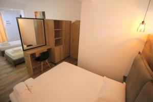 Postel nebo postele na pokoji v ubytování Ortus Rooms