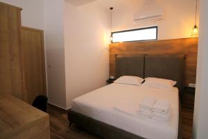 Postel nebo postele na pokoji v ubytování Ortus Rooms