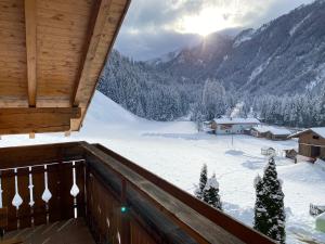 a view from the balcony of a cabin in the snow at Felda Appartements in Lappago