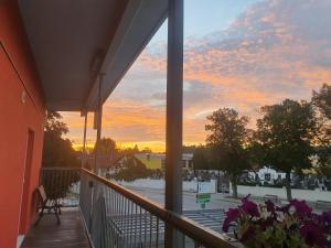 a view from the balcony of a building at sunset at Motel Angern in Angern an der March