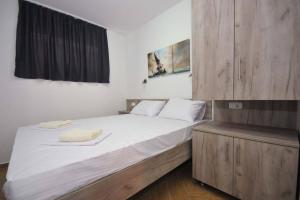 Voodi või voodid majutusasutuse Apartments A Čanj toas
