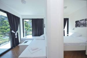 Voodi või voodid majutusasutuse Apartments A Čanj toas