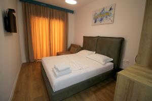 Postel nebo postele na pokoji v ubytování Ortus Rooms
