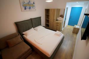 Postel nebo postele na pokoji v ubytování Ortus Rooms