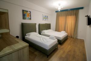 Postel nebo postele na pokoji v ubytování Ortus Rooms
