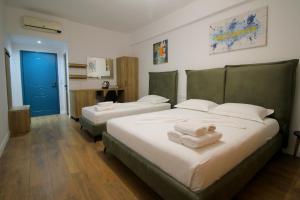 Postel nebo postele na pokoji v ubytování Ortus Rooms