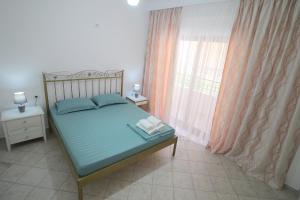 Postel nebo postele na pokoji v ubytování Ortus Rooms