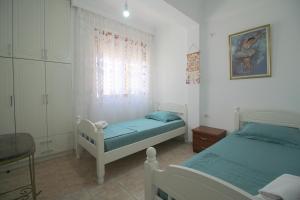 Postel nebo postele na pokoji v ubytování Ortus Rooms