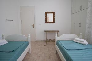 Postel nebo postele na pokoji v ubytování Ortus Rooms