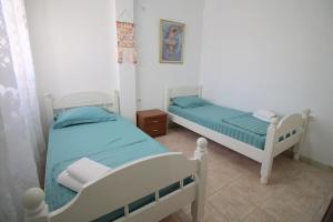 Postel nebo postele na pokoji v ubytování Ortus Rooms