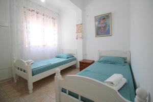 Postel nebo postele na pokoji v ubytování Ortus Rooms