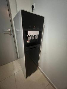 a refrigerator in a room with its door open at Seeds Hotel Putrajaya in Putrajaya