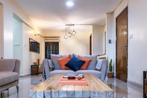 a living room with a couch and a coffee table at Sophie's World- 2 Bedroom luxury apartment in Lubowa