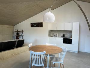 a kitchen and dining room with a table and chairs at Apartamento EKIALDE 