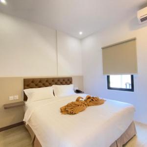 Postel nebo postele na pokoji v ubytování BATAM 1 HOTEL