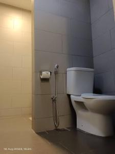 a shower in a bathroom with a toilet at Swiss Hotel Heritage Boutique Melaka in Melaka