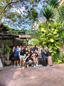 a group of people posing for a picture at Pujihouse One in Legian