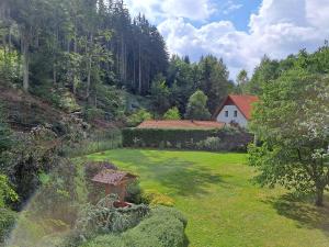 a large yard with a house in the background at Villa Gejzir 37 in Karlovy Vary