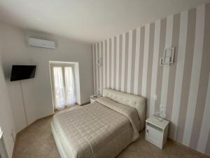 Letto o letti in una camera di Terrazza su Tocco