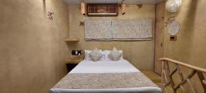 Voodi või voodid majutusasutuse Matsya toas