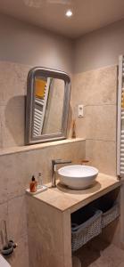 a bathroom with a sink and a mirror at Cherche Midi in Noves +48 photos