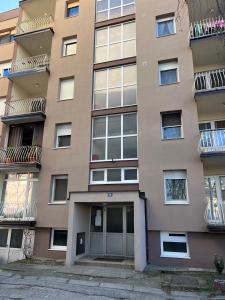 an apartment building with a door in front of it at Studio apartman Dora in Vinkovci