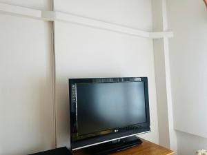 a flat screen tv sitting on top of a table at Apartament Cornelia in Buzău