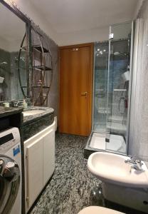 a bathroom with a shower and a sink and a toilet at Casa Vignolet : la finestra su Pont-Saint-Martin in Pont-Saint-Martin +45 photos