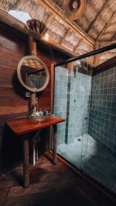 a bathroom with a sink and a mirror at Villa Sabiá - Eco Bungalows in Prea +60 photos