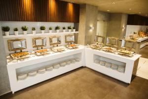 a buffet line with plates of food on display at Pyramisa Suites Hotel Cairo in Cairo