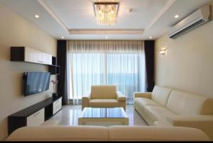 a living room with a couch and a tv at See View Apartment Budva Becici in Budva