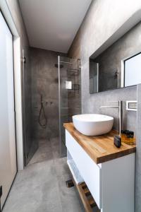 a bathroom with a sink and a shower at O&O Group - Amazing Seaview 3 BR Apartment in Bat Yam