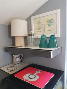 a shelf with two lamps on top of a desk at South Ford Haven in Dartmouth