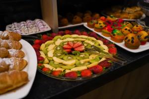 a buffet of fruit and pastries on a table at Mai İnci Otel in Antalya