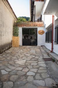 a courtyard with a gate and a stone walkway at Maries Thasos Stone Villa in Mariaí