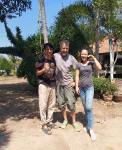 a group of three people posing for a picture at Wandee Resort Bankrut in Ban Krut