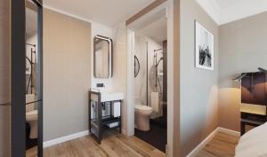 a bathroom with a sink and a toilet at Pestana Park Avenue in New York