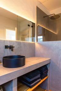 a bathroom with a sink and a mirror at N6Quartier in Bad Münstereifel