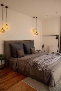 a bedroom with a large bed in a room at N6Quartier in Bad Münstereifel